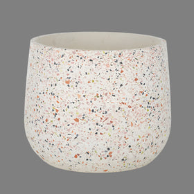A pink terracotta pot with a multicolored speckled pattern.