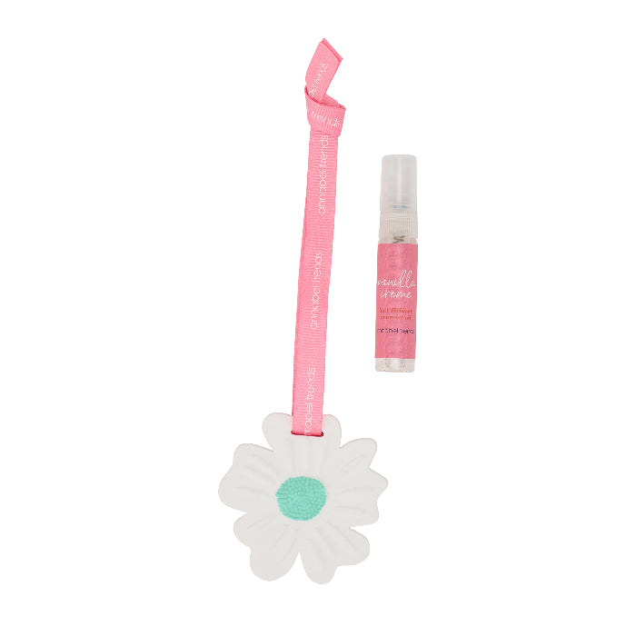 Pink fragrance bottle with a flower-shaped holder on a white background