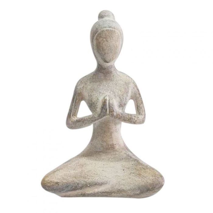 A small seated figurine statue in a meditative pose with hands pressed together, made from a textured stone-like material in warm gray-beige tones, isolated on a white background.