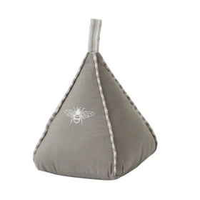 Gray bean-shaped pillow with a bee design on a white background