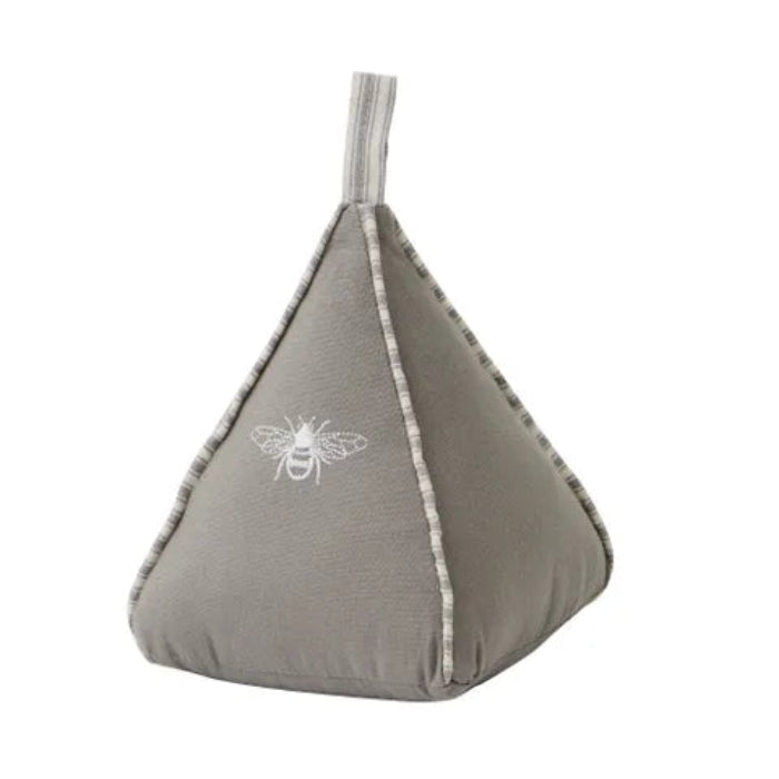 Gray bean-shaped pillow with a bee design on a white background