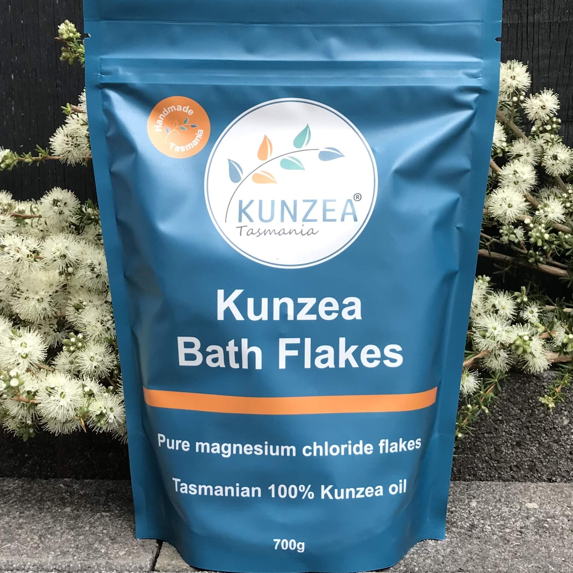 Kunzea Bath Flakes packaging with Kunzea Tasmania logo against a natural background