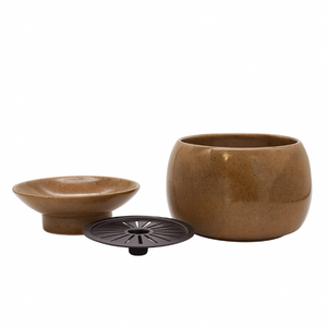 Brown ceramic pot with a smaller bowl and black lid on a white background