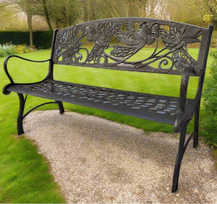 Decorative metal bench with intricate designs on a white background