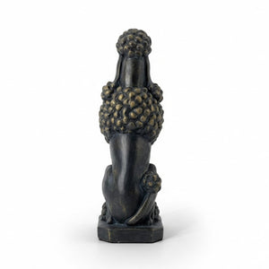 A dark bronze-finished sculpture of a poodle sitting upright on a rectangular base, photographed against a clean white background.