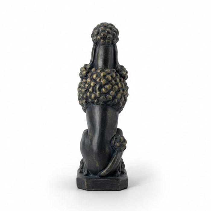 A dark bronze-finished sculpture of a poodle sitting upright on a rectangular base, photographed against a clean white background.
