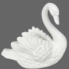 White ceramic swan figurine on a white background