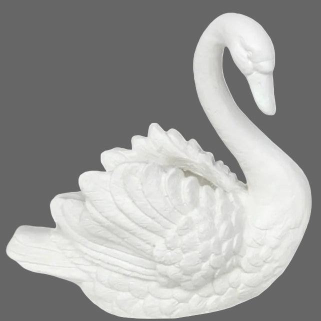 White ceramic swan figurine on a white background