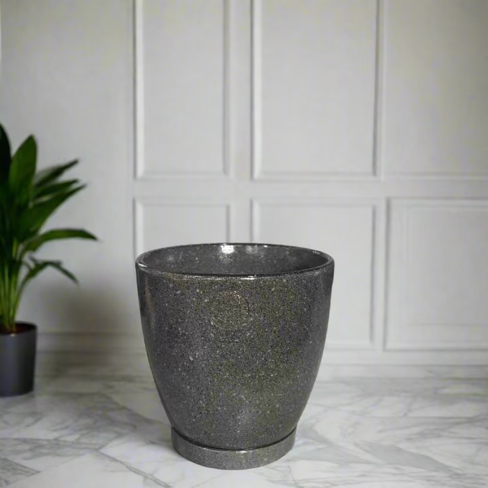 green speckled pot on a counter with a store interior in the background