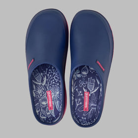 Pair of navy blue clogs with floral patterns on a white background
