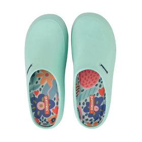 Pair of light blue slip-on shoes with colorful floral patterns on a white background