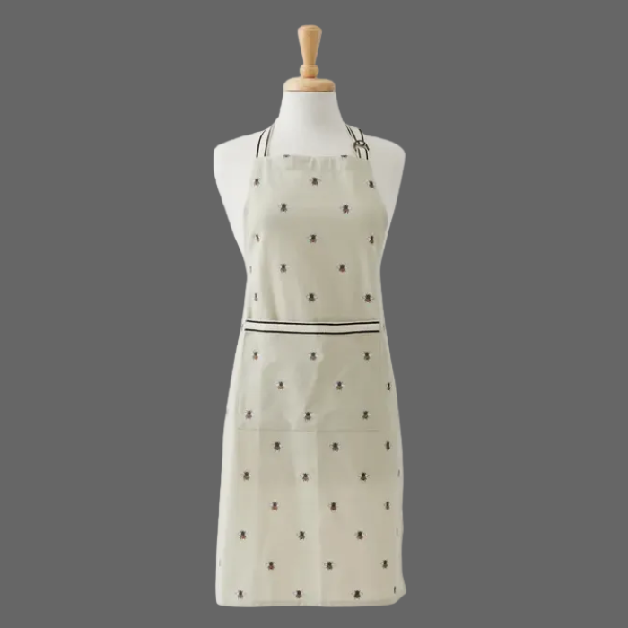 White apron with black pattern on a mannequin against a white background
