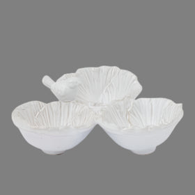 Set of three white ceramic bowls with textured surface on a white background