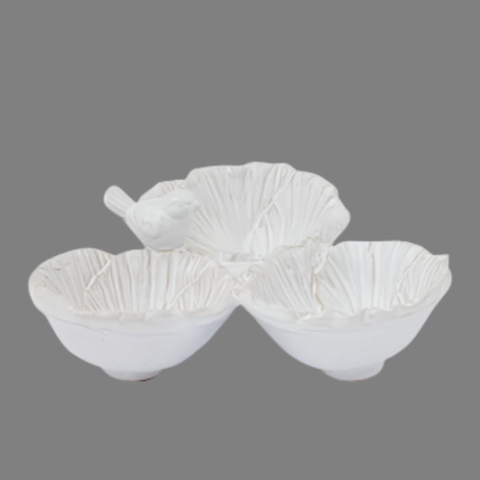 Set of three white ceramic bowls with textured surface on a white background
