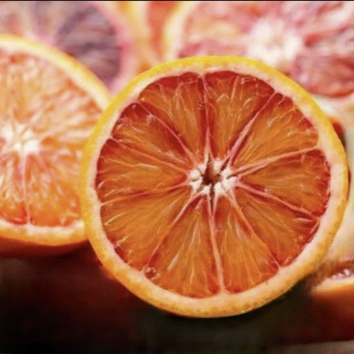 Close-up of sliced blood oranges with a blurred background