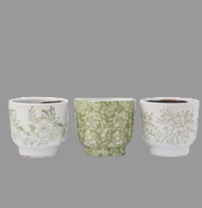 Three decorative pots with floral patterns on a white background
