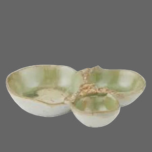 Set of three ceramic bowls with a green and brown glaze on a white background