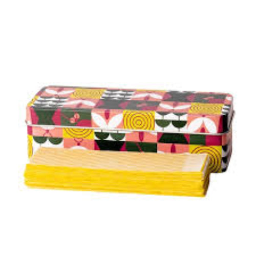 Pack of yellow paper towels with a colorful patterned box on a white background