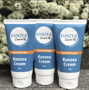Three tubes of Kunzea Cream with 'Kunzea Care' branding against a natural background.