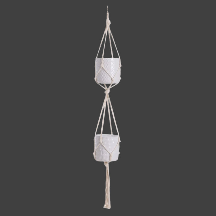 Macrame plant hanger with two ceramic pots on a white background