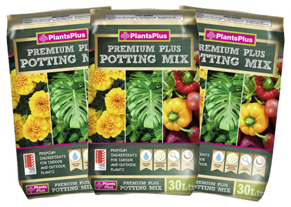 Three packages of PlantsPlus Premium Plus Potting Mix with images of plants on the packaging.