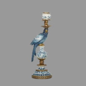 Decorative candlestick with a bird figure on a white background