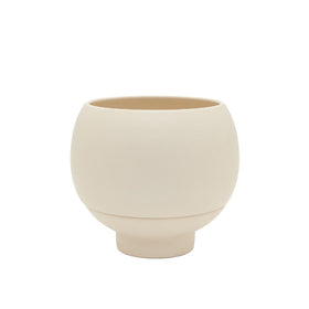 Beige ceramic planter on a white background