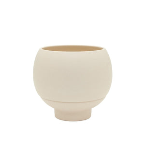 Beige ceramic planter on a white background