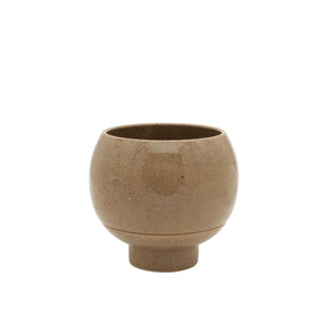 Brown ceramic cup on a white background