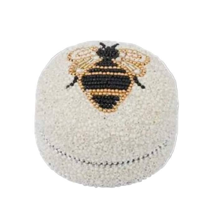 Beaded box with a bee design on a white background