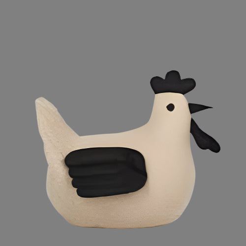 Beige and black rooster-shaped object on a white background