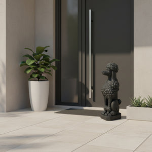 A dark gray cast stone poodle garden statue, shown from a three-quarters profile view against a plain white background.