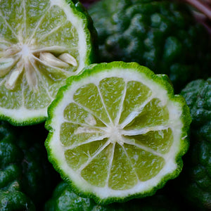 Close-up of sliced green fruit with a wicker basket in the background