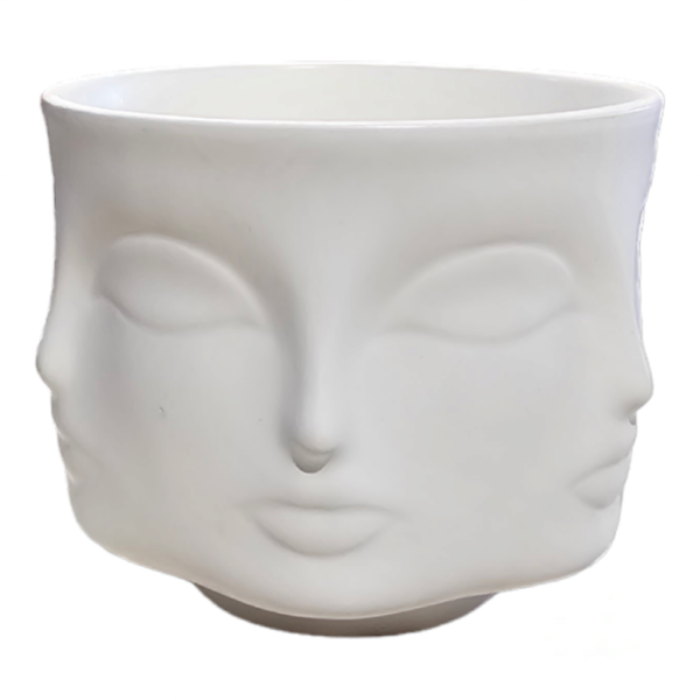 White ceramic face-shaped planter on a white background