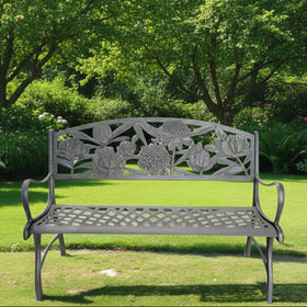 A solid cast iron garden bench with a dark brown and bronze powder-coat finish, featuring hand painted gold highlights and floral patterns.