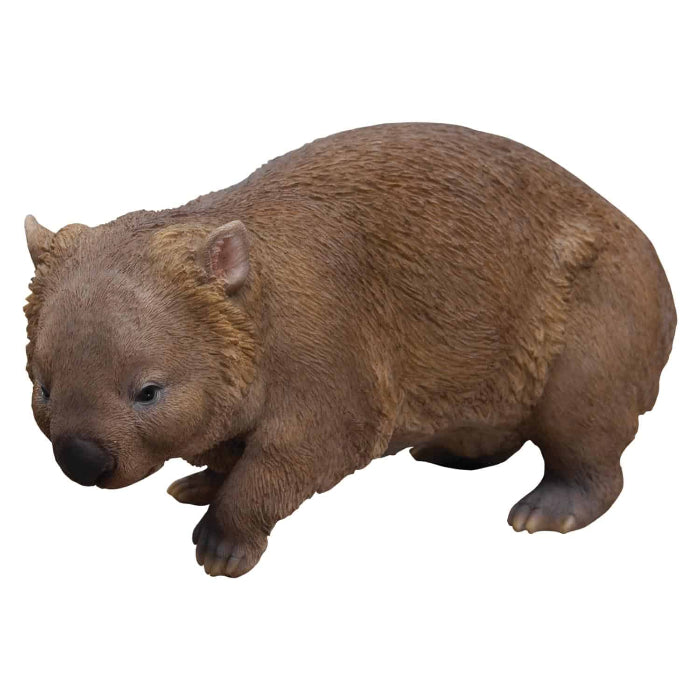 Brown wombat figurine on a white background