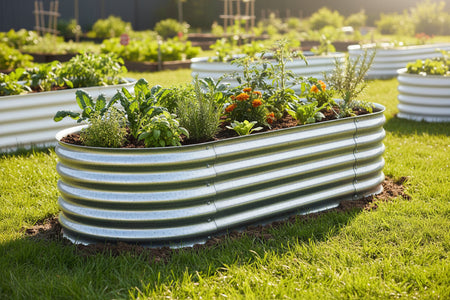 White metal garden beds with plants in a garden setting